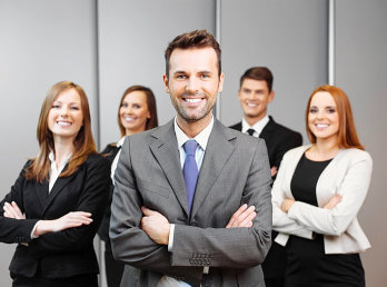 office staffs smiling at the camera